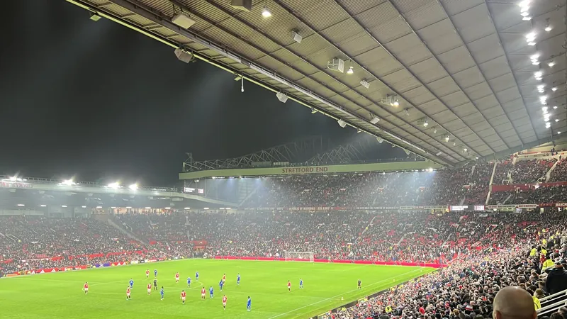 Old Trafford under floodlights at a Carabao Cup tie, October 2024