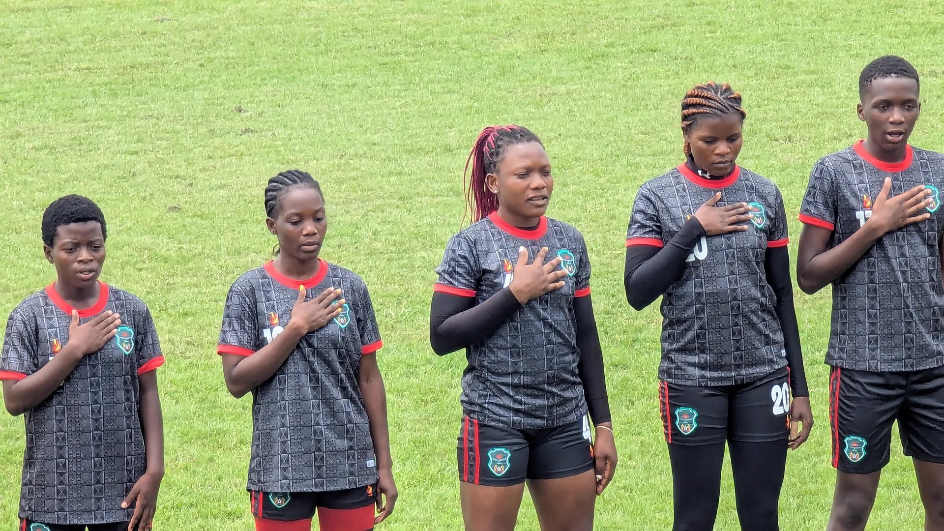 Malawi players lined up for the anthem before a match against Zambia